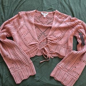 Cute pink open front knit sweater.